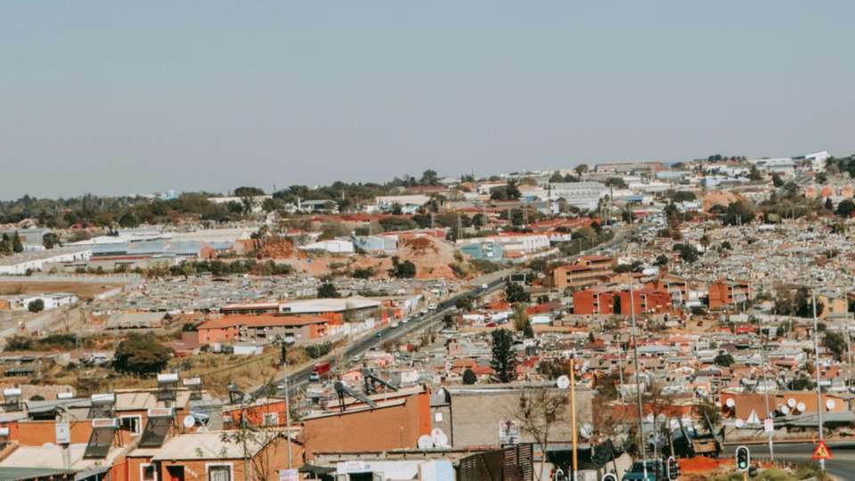 Rooftops of houses in Soweto seen from a hill